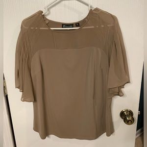Flowy tan short sleeved top with see through shoulder